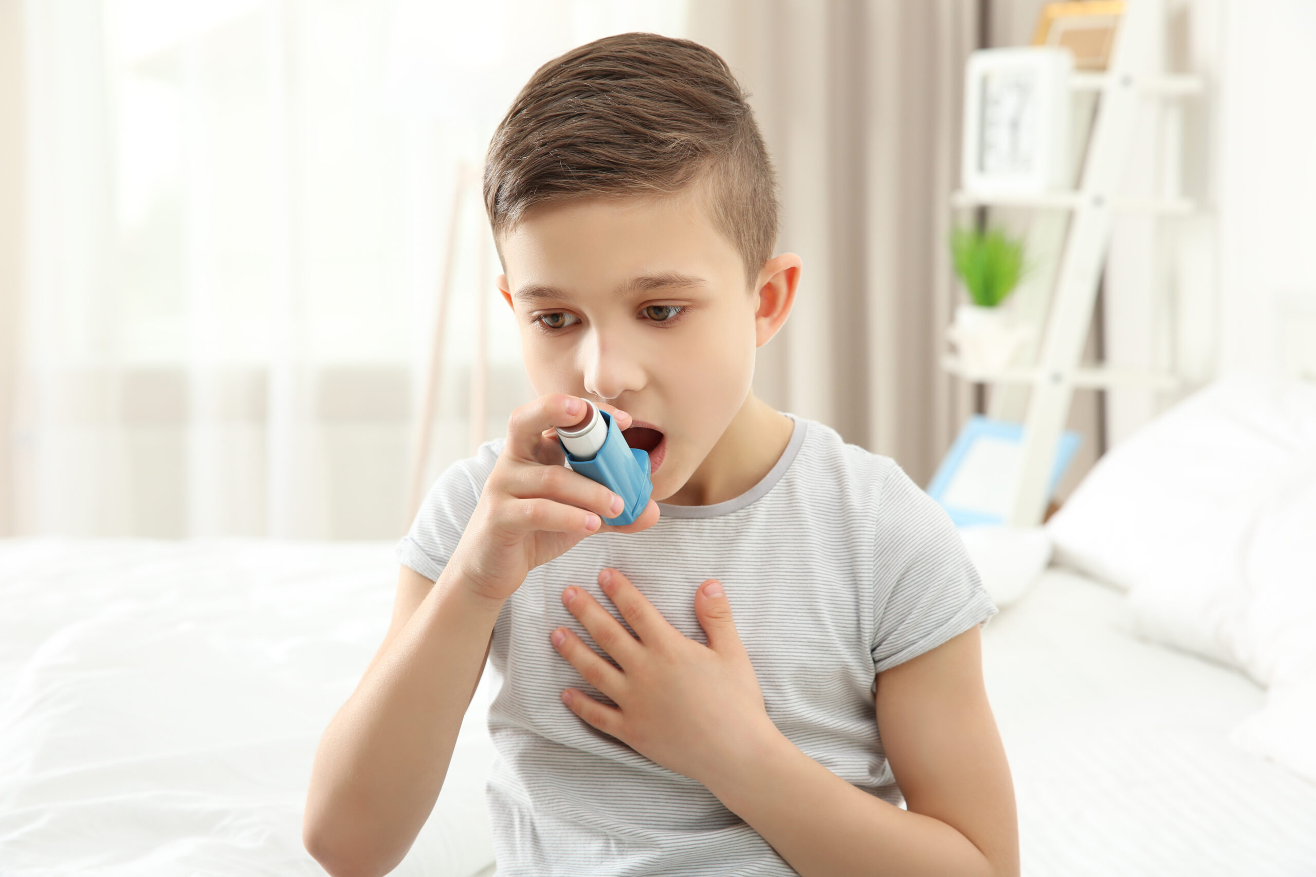 Child experiencing breathing difficulty using an Albuterol inhaler for quick relief, illustrating proper Albuterol Dosage and administration.