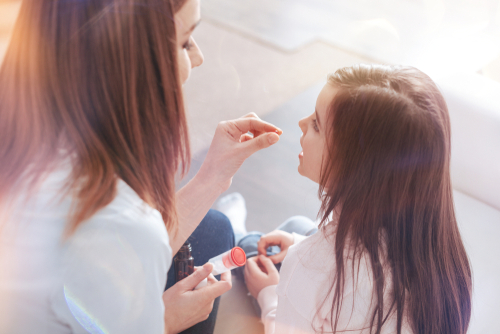 Kid learning how to swallow pills